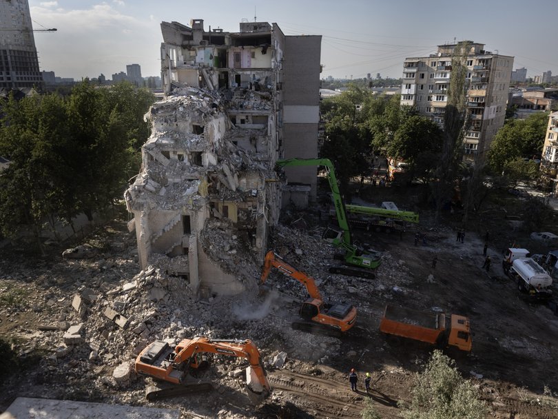 Rescue workers dig through the rubble in the search for survivors.