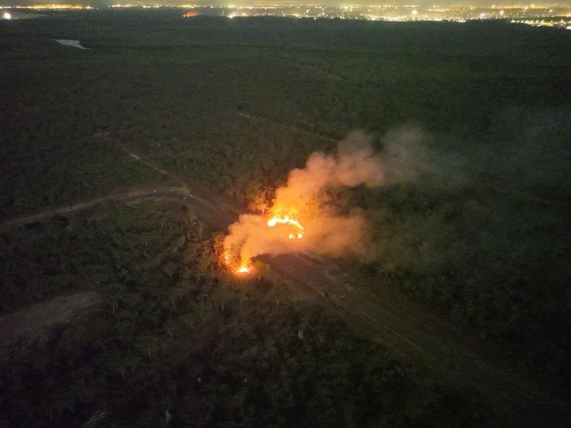 An aerial photo of a car alight.