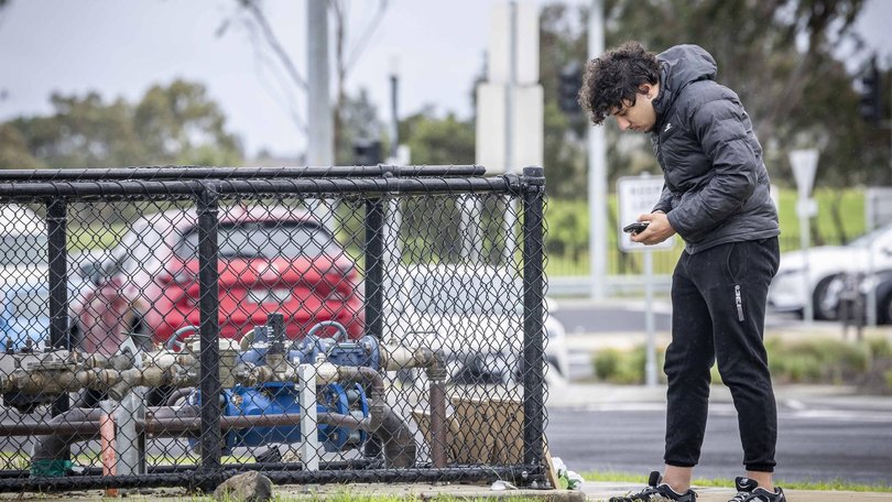 Tributes are left at the scene of a fatal stabbing in Craigieburn. Picture: Jake Nowakowski