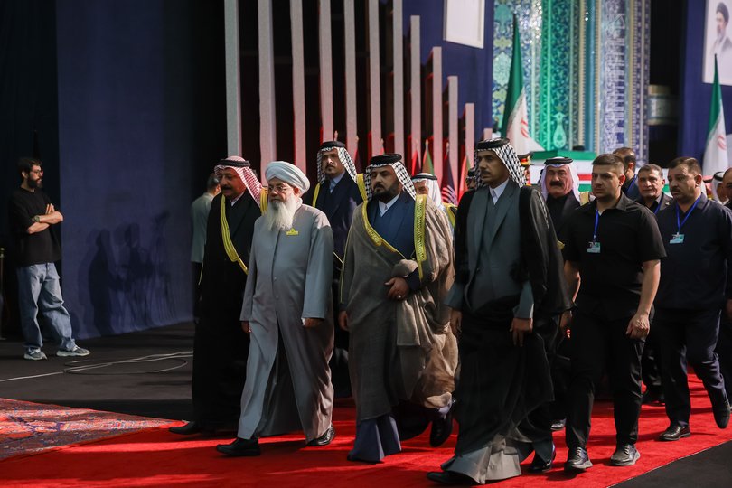 Foreign and domestic officials walk past coffins containing the late Iranian Supreme Leader, Ayatollah Ali Khamenei, and members of his family at Imam Khomeini Grand Mosque on July 3, 2026 in Tehran, Iran.