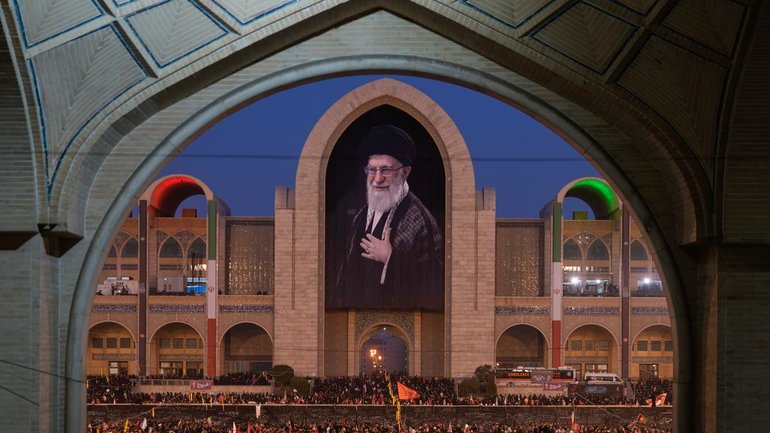 Mourners have gathered beneath a portrait of the late Iranian supreme leader Ayatollah Ali Khamenei. (AP PHOTO)