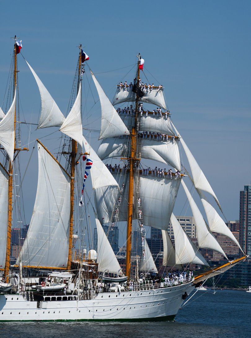 People crowd upon the masts of one of the sailing ships parading through New York harbor on July 4, 2026.