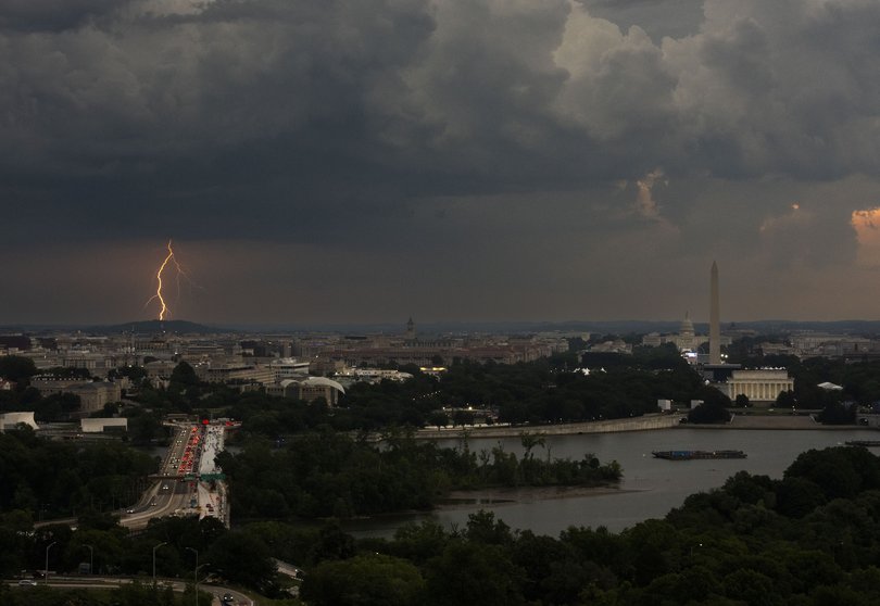 Lightning in the distance beyond Washington, as seen from a building in Arlington, Va. on July 4, 2026. 