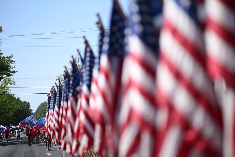 A line of flags, during the Greeley Stampede's Independence Day parade in Greeley, Colo., July 4, 2026. 