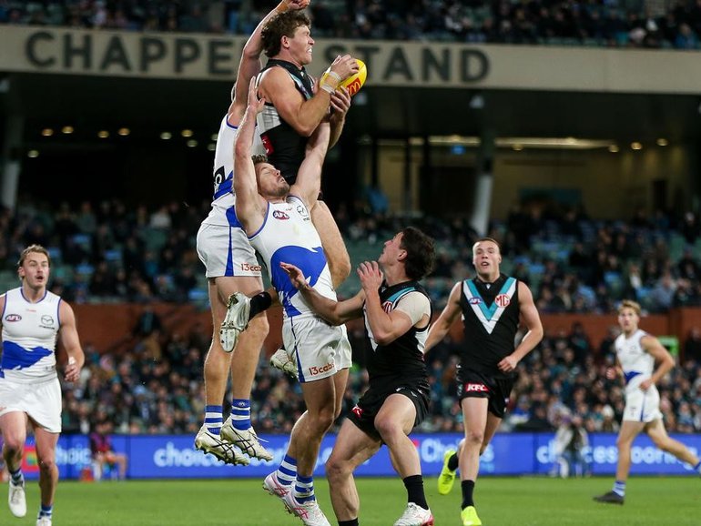 Mitch Georgiades bagged three goals and this soaring mark as Port Adelaide beat North Melbourne. 