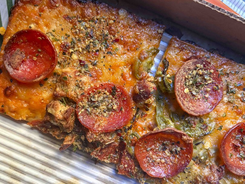 The Goopfellas pizza has a gluten-free crust, and is topped with “no-vodka sauce,” turkey sausage, pepperoni, jalapeños and a cheese blend. 