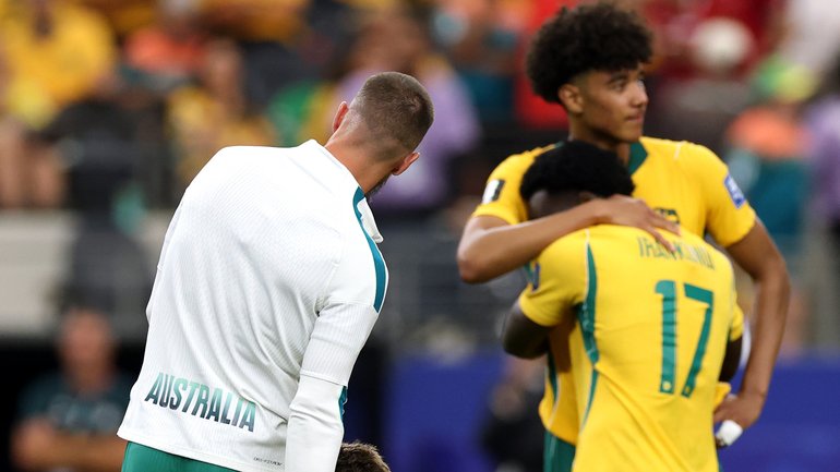 The dejected Socceroos on Saturday.