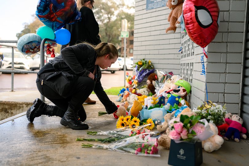 Heartbroken locals have laid flowers at a growing tribute to the young boy.