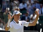 Defending champ Jannik Sinner acknowledges his fans after defeating Jan-Lennard Struff at Wimbledon. 