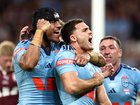 Nathan Cleary of the Blues celebrates with teammates after scoring his team's first try during game three of the Men's State of Origin series.