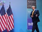US President Donald Trump has spoken of NATO unity after earlier criticising alliance members. 