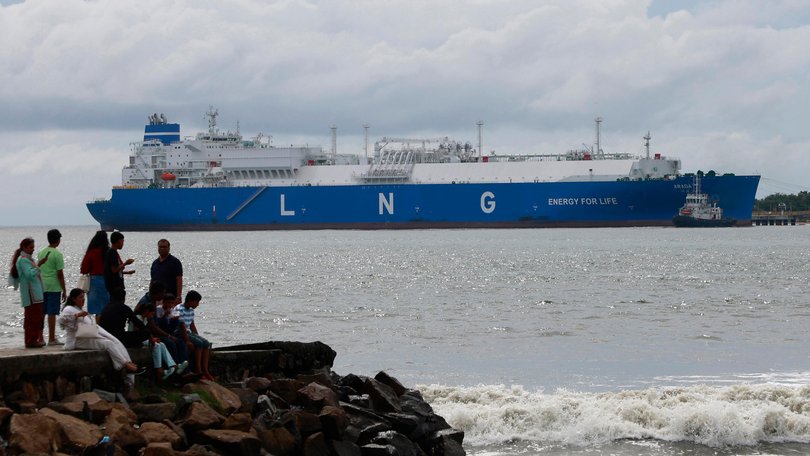 Pre-Monsoon clouds gather above an LNG tanker in India.