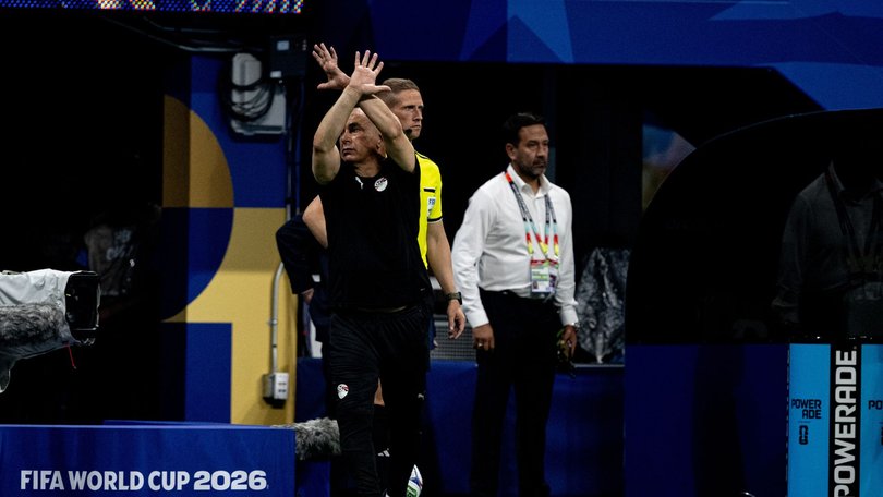 Hossam Hassan holds his arms up in an X shape to signal racial abuse after Argentina’s match-winner two minutes into stoppage time. 