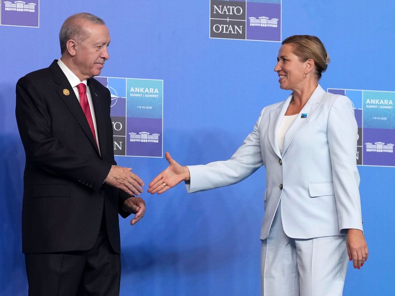 Denmark's Prime Minister Mette Frederiksen greets Turkish President Recep Tayyip Erdogan in Ankara during the NATO summit.