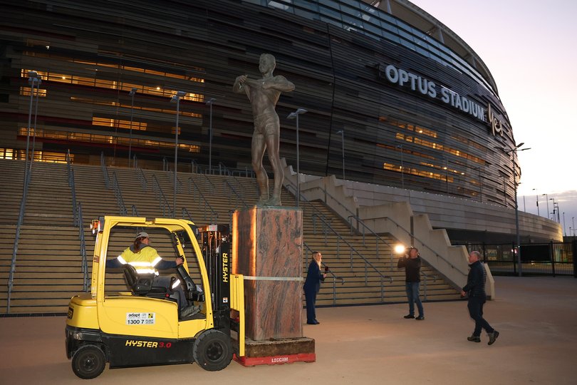 The statue of former AFL player Nicky Winmar is transported to a storage location earlier this month.