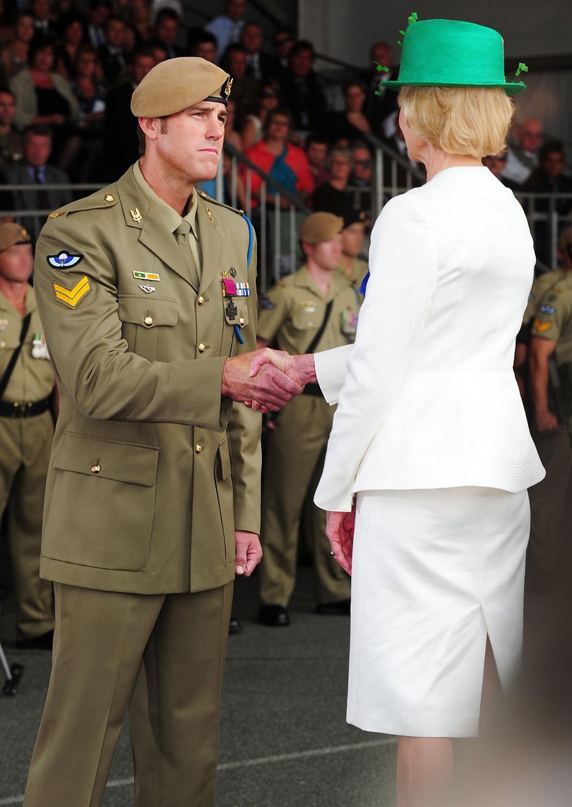 Governor-General of the Commonwealth of Australia, Her Excellency Ms Quentin Bryce congratulates Corporal Ben Roberts-Smith after awarding him the Victoria Cross.
