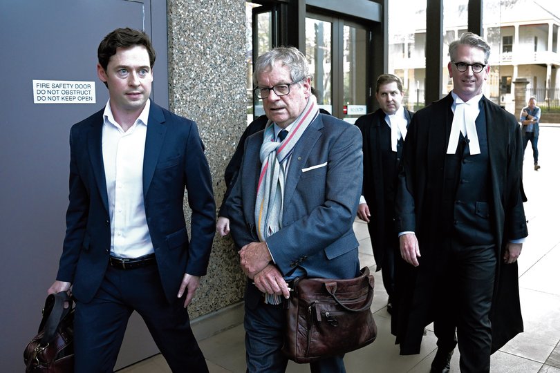Journalists Nick McKenzie (left) and Chrids Masters along with barrister Nicholas Owens leave the Federal Court in Sydney, Thursday, June 1, 2023.