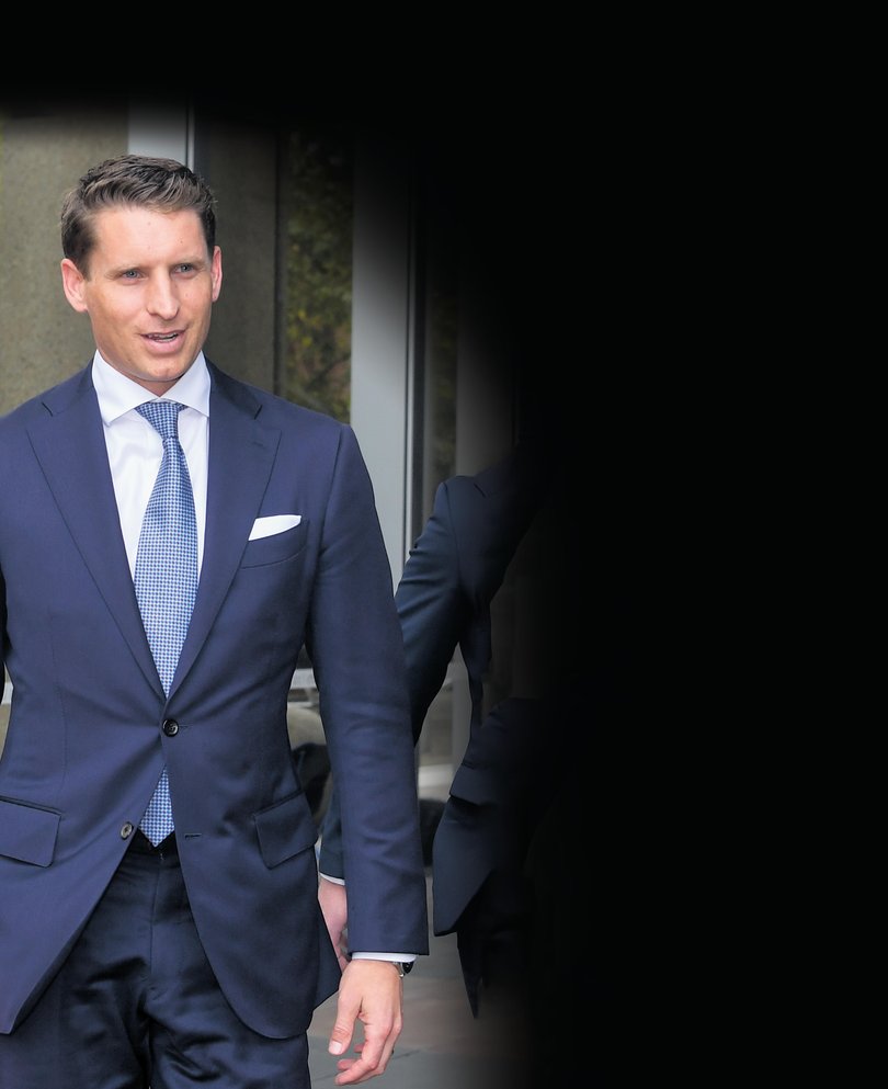 Assistant Minister for Defence Andrew Hastie (left) leaves the Federal Court of Australia in Sydney, Thursday, March 24, 2022.