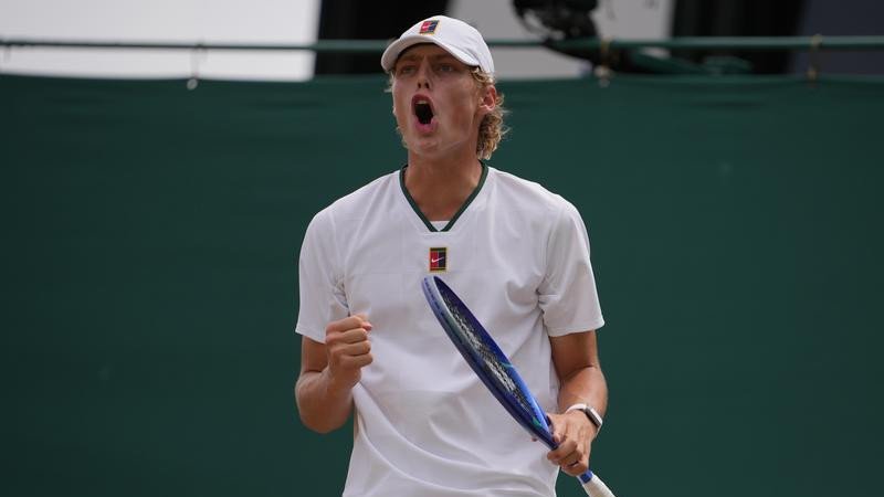 Cruz Hewitt roars after winning a point en route to the final of the Wimbledon boys' event. 