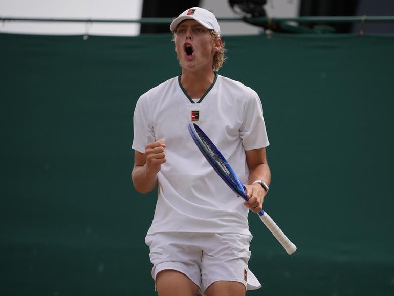 Cruz Hewitt roars after winning a point en route to the final of the Wimbledon boys' event. 