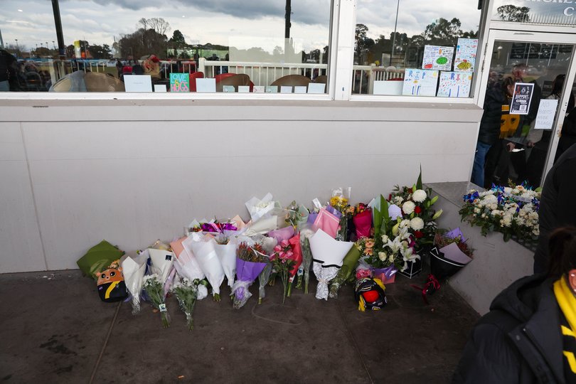 Flowers are laid at a memorial service for Nathan, Fitzy, Fitzgerald.