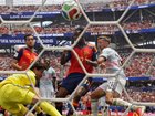 Belgium keeper Senne Lammens is beaten by Mikel Merino (front left) for Spain's winning goal. 