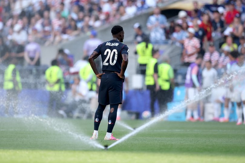 Folarin Balogun #20 of the United States looks on during a hydration break.