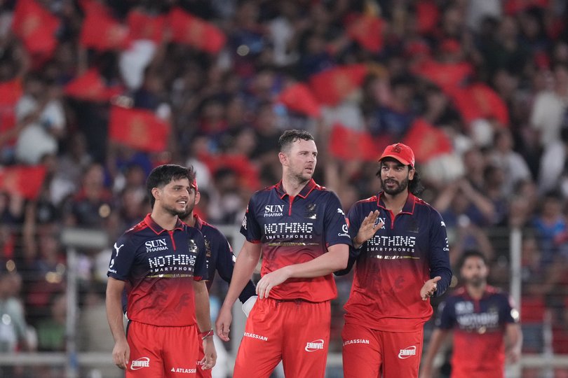Royal Challengers Bengaluru's Josh Hazlewood celebrates the wicket of Gujarat Titans' Arshad Khan with with teammates during the Indian Premier League final cricket.