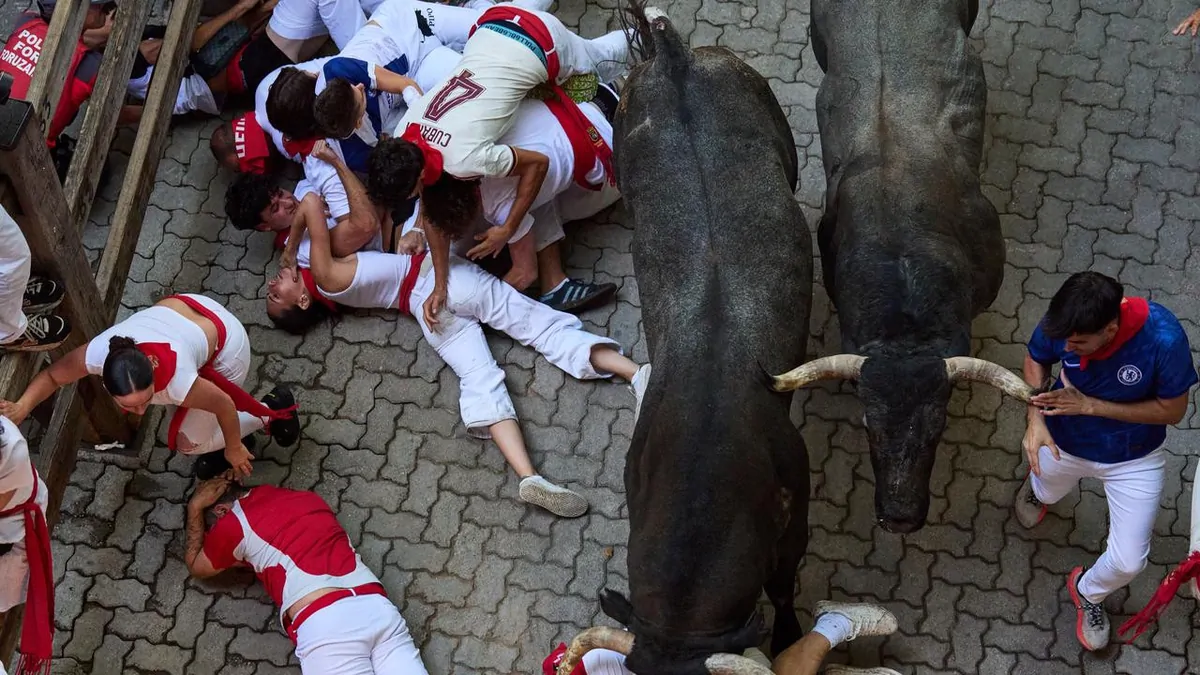 Spain’s San Fermin bull run descends into chaos after runner gored in the face in Pamplona