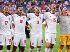 England players celebrate their win.