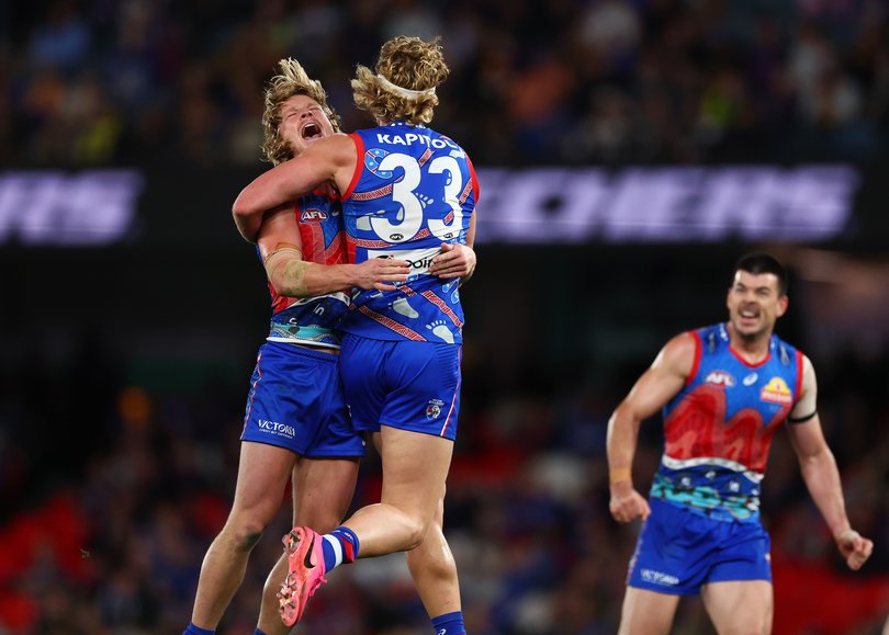 MELBOURNE, AUSTRALIA - JULY 12: Aaron Naughton of the Bulldogs (C) celebrates with Cody Weightman of the Bulldogs after kicking a goal during the round 18 AFL match between Western Bulldogs and West Coast Eagles at Marvel Stadium, on July 12, 2026, in Melbourne, Australia. (Photo by Daniel Pockett/Getty Images via AFL Photos)