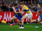 Marcus Bontempelli of the Bulldogs and Willem Duursma of the Eagles compete for the ball.