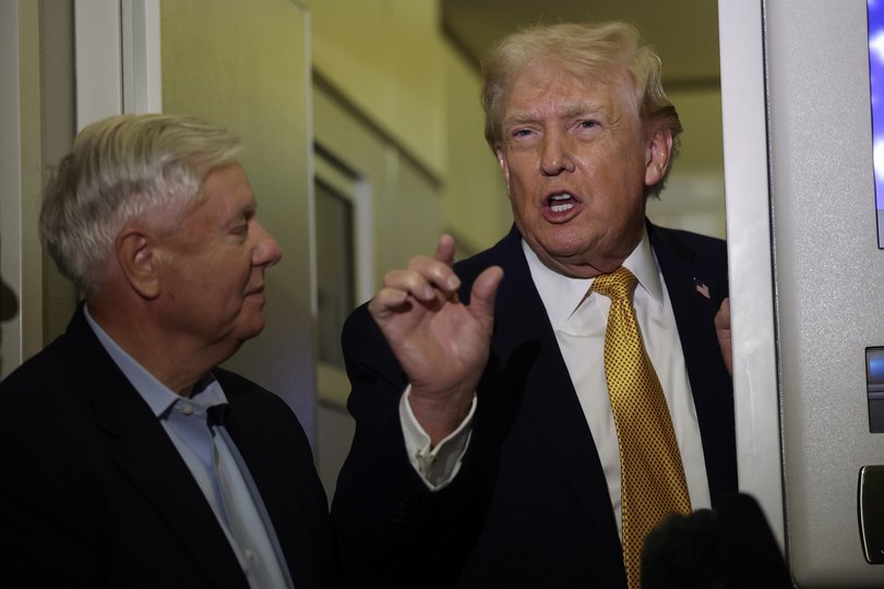Donald Trump and Lindsey Graham (R-SC) speak to the media aboard Air Force One enroute to Washington, DC on January 04, 2026.