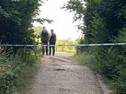 Police have launched a murder probe after a body was discovered in a suitcase at a park, close to where a children’s teddy bear hunt event had been taking place.