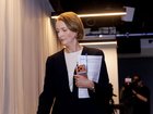 Telstra CEO Vicki Brady leaves a press conference at Telstra HQ after returning from leave