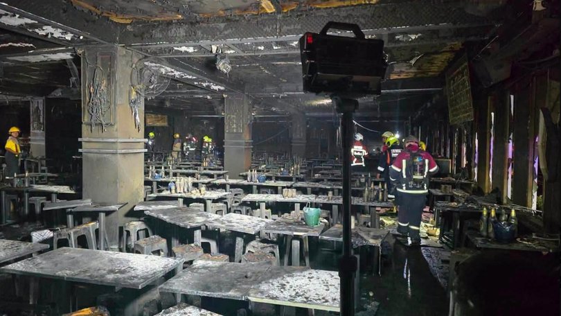 Photos from the scene show charred tables and chairs alongside extensive damage up walls inside the pub.
