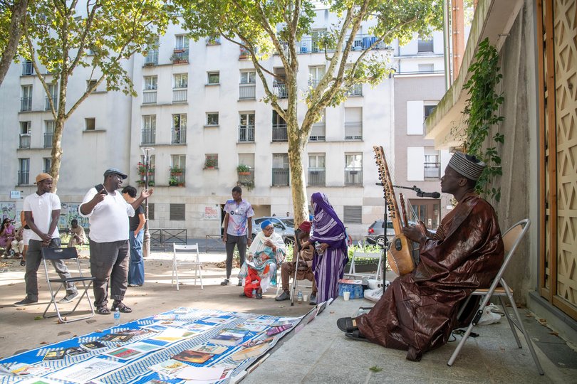 A musician performing at a public square named for Cheikha Rimitti, the celebrated Algerian singer, in Paris.