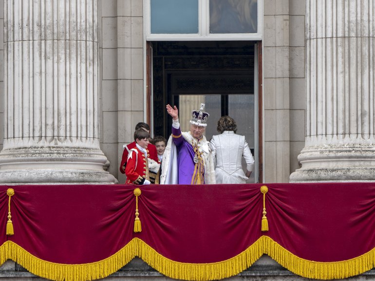 King Charles III, Queen Camilla and members of the royal family wave from the Buckingham Palace balcony after his coronation in London on May 6, 2023.  
