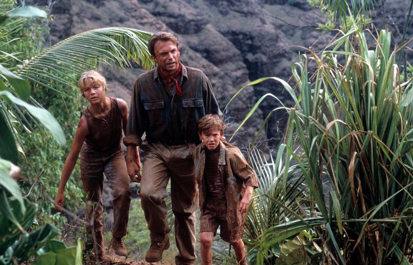 Ariana Richards walks with Sam Neill and Joseph Mazzello in a scene from Jurassic Park, 1993.