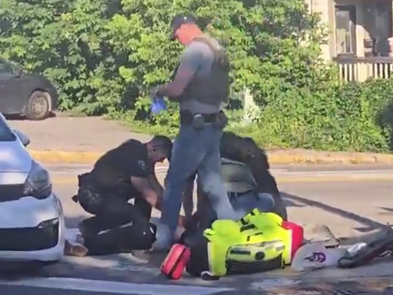 Footage has revealed the moment Immigration and Customs Enforcement (ICE) agents handcuffed a dying migrant on the ground.