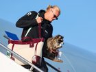 Norway’s Erling Haaland gets off the plane with a stuffed raccoon.