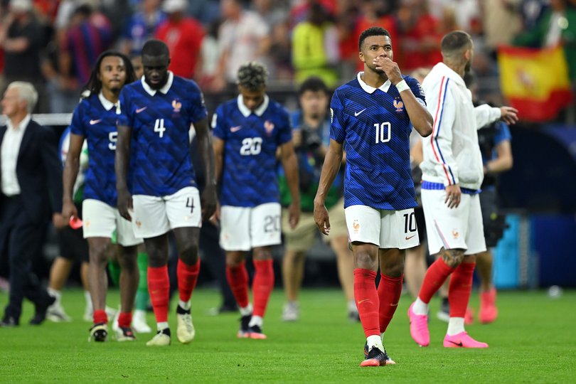 French players take in the defeat.