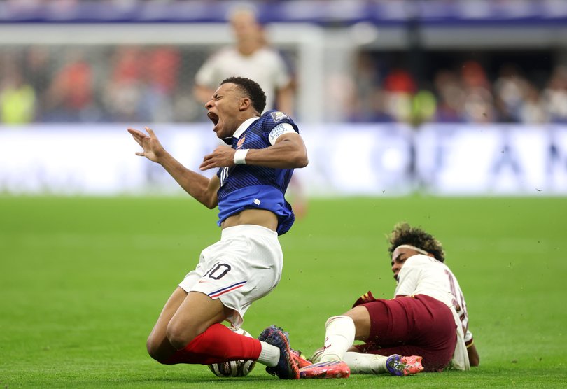 French star Kylian Mbappe goes down.