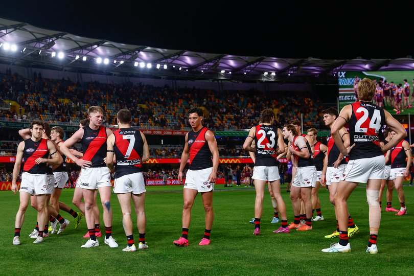 Essendon leave the field following the 2026 AFL Round 18 match between the Brisbane Lions and the Essendon Bombers.