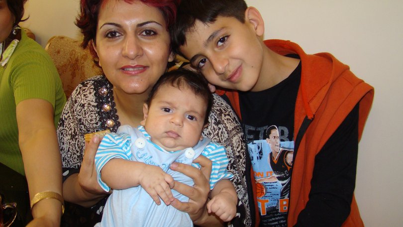 A treasured family photo of Daniel Hidden with his mother Faranak Tohidi and newborn brother Iliya in Iran.
