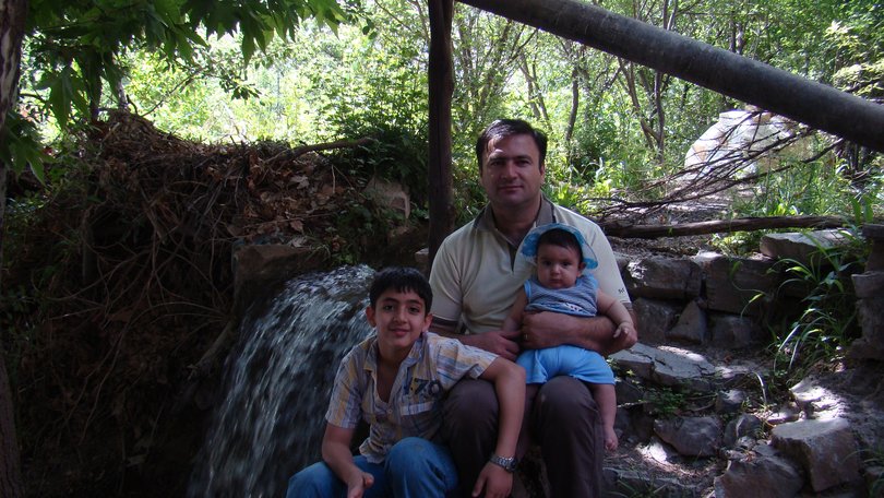 Hojjat Jamshidi with sons Daniel and baby Ilya at a family favourite waterfall in Iran. Daniel was about nine years old.