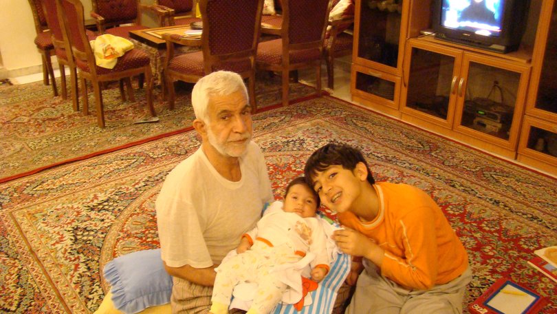 Daniel Hidden, aged about nine, with his grandfather and baby brother Iliya in Iran.
