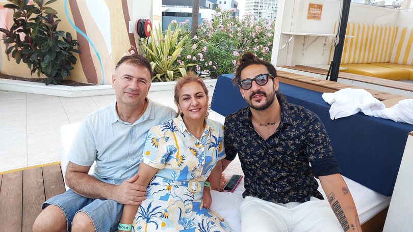 Daniel Hidden with his parents, Faranak Tohidi and Hojjat Jamshidi, on his 25th birthday.