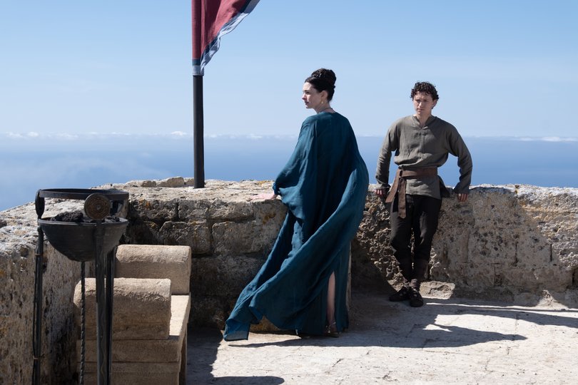 Anne Hathaway as Penelope and Tom Holland as Telemachus.