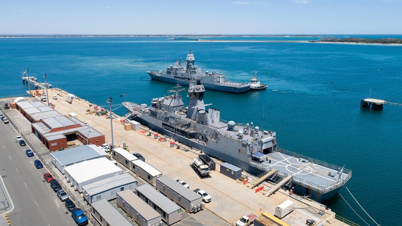 HMAS Perth moves into position in front of HMAS Ballarat.